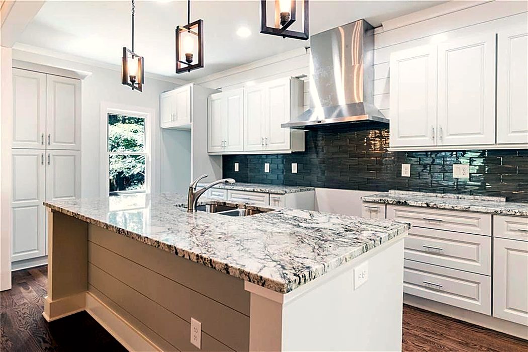 White Kitchen with Granite Island